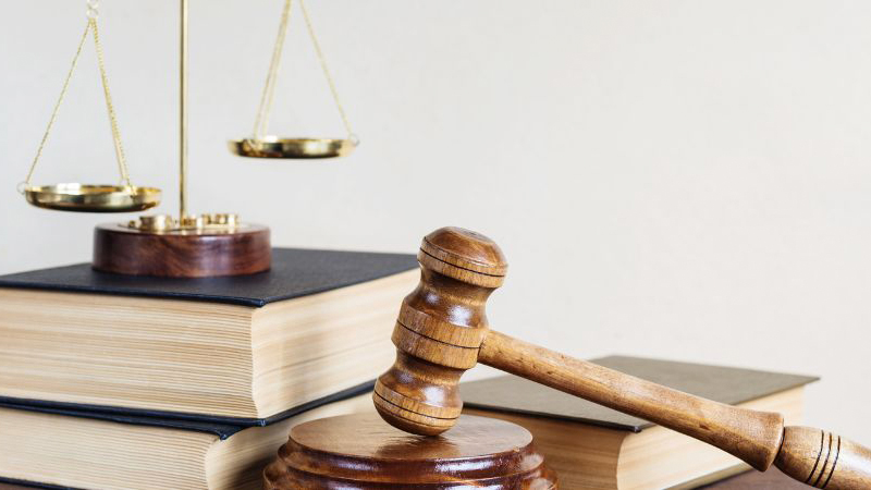 Gavel, balancing scale and some books